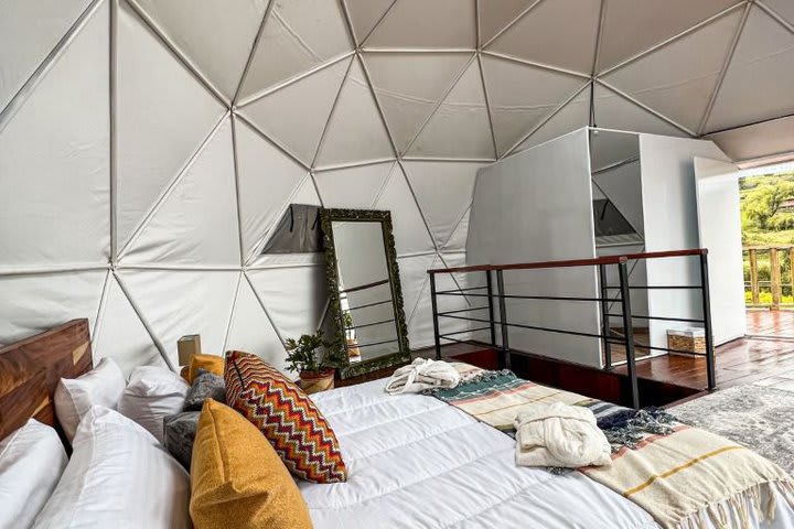 The cabins have geodesic domesc