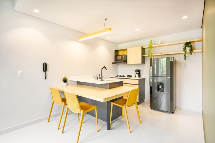 Dining area and kitchen in a multiple suite