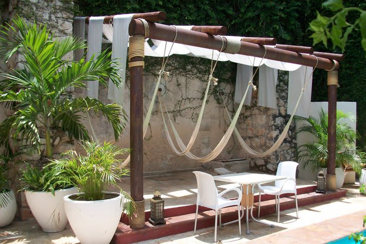 Hammocks by the pool at Hotel Piedra de Agua in Merida