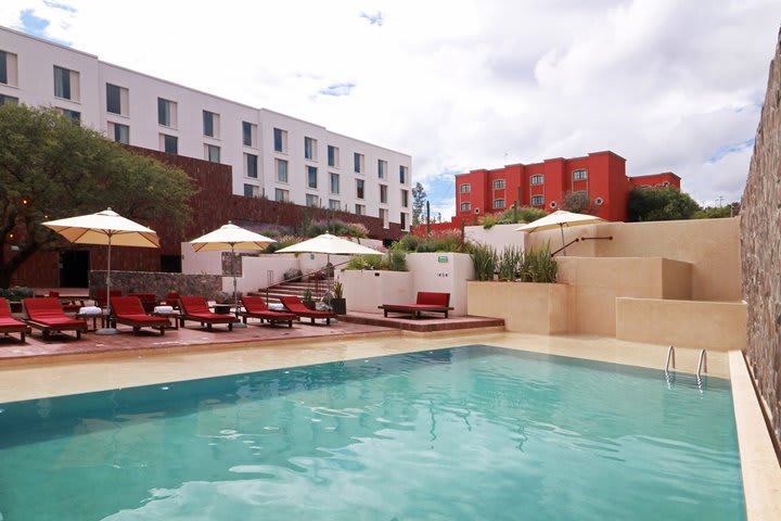 Sun loungers next to the pool