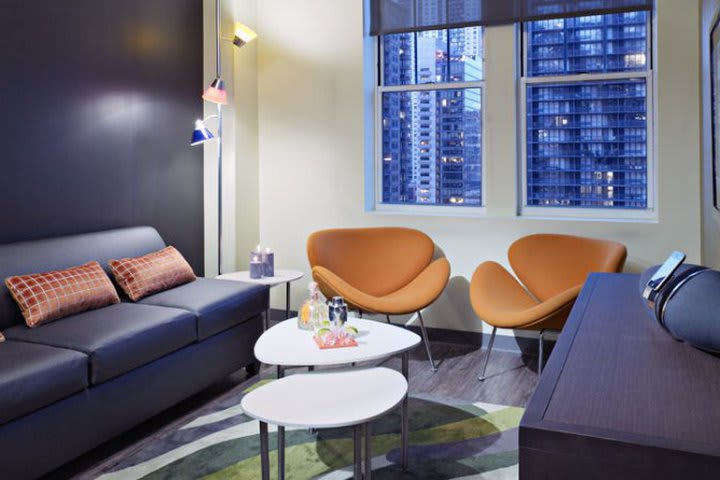 Suite with sitting area at the Acme Hotel Company Chicago