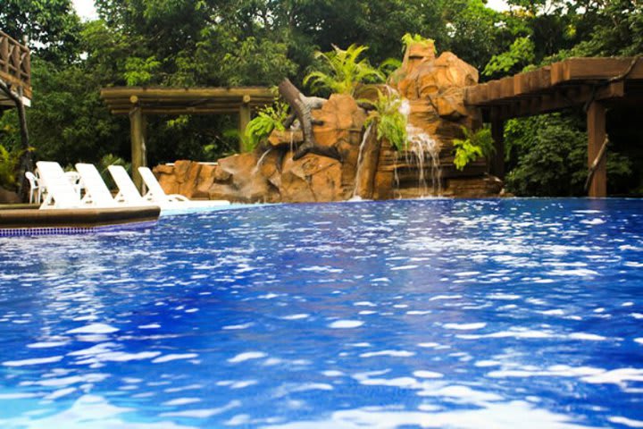 The pool at Hotel Expo Centro Zona Libre has a sun terrace with sun loungers