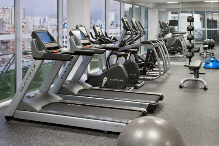 Fitness center with cardiovascular equipment and weights