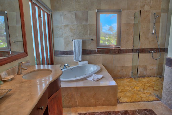 Private guest bathroom with tub and shower