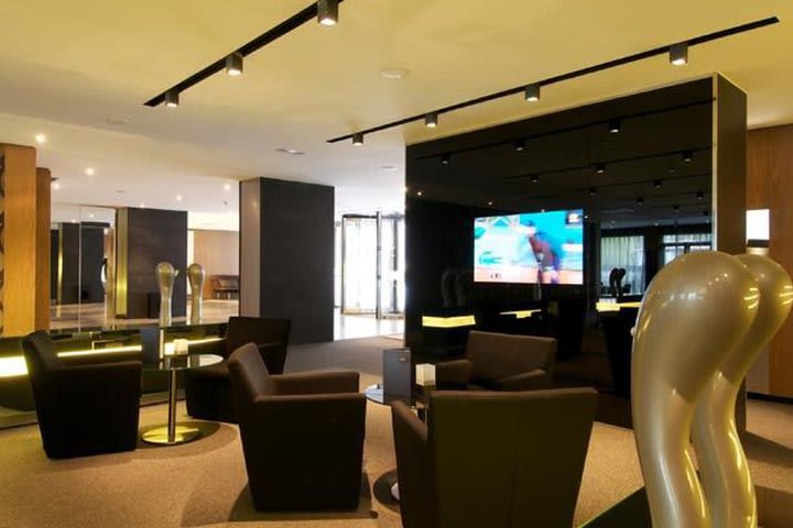 Lounge with flat-screen TV at AC Hotel by Marriott Atocha in Madrid