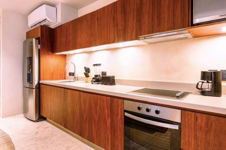 Kitchen in a studio with private pool and jungle view