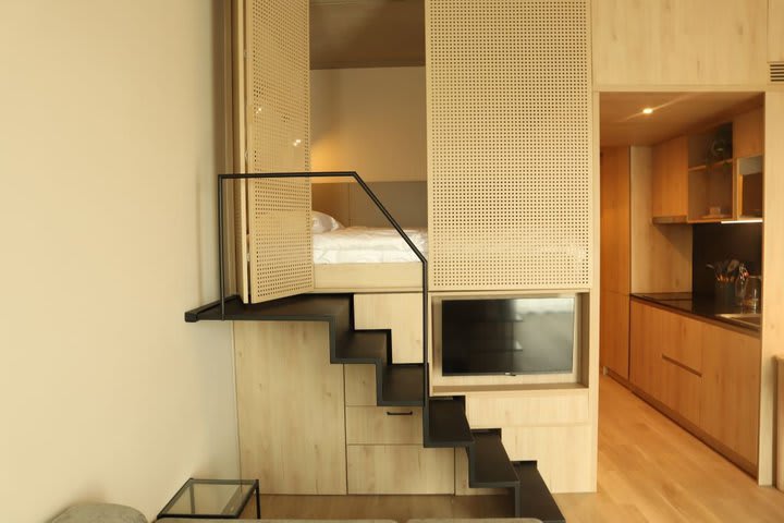 Sleeping area and kitchen in an executive loft