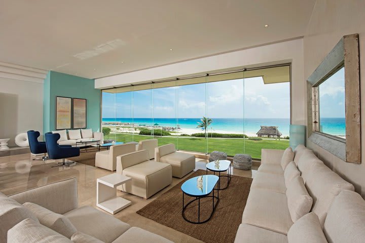 The business lounge has a sitting area and views to the beach