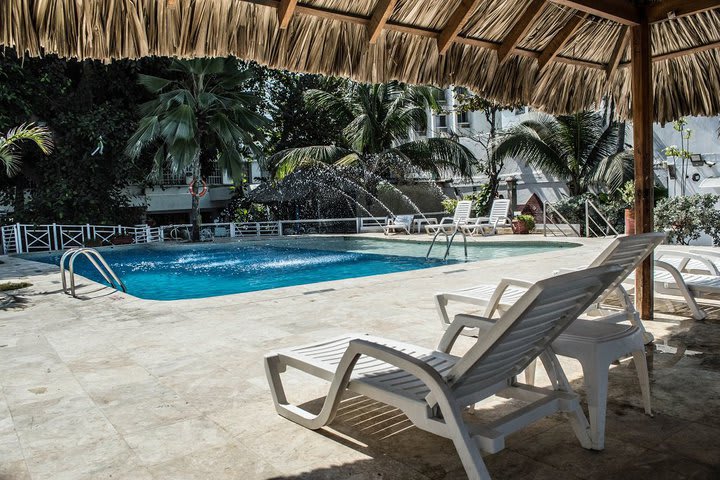 Sun loungers next to the pool