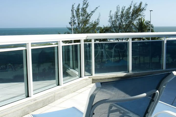 Balcony in a guest room facing the ocean at Sol da Barra