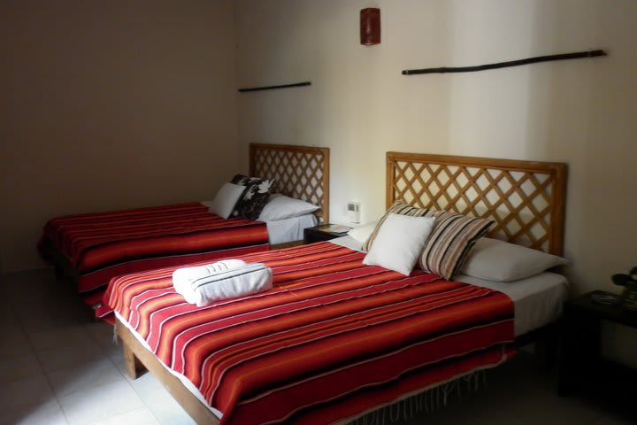 Guest room with two beds at Hotel Kin Ha Pueblo