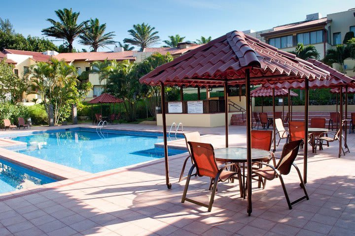 Sun terrace with a pool and sun loungers