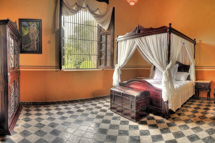 Guest rooms decorated with original art works at Hacienda Kaan Ac